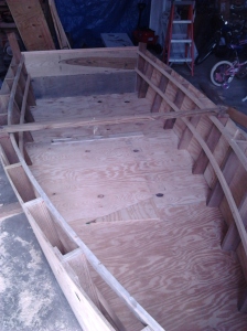 Here I added 2 side rails to help form the shape and to keep the side pieces from racking.  I have coated all joints  in the boat with epoxy and let it dry before gluing the pieces together. I coated the backside of the rails so it would be waterproof.